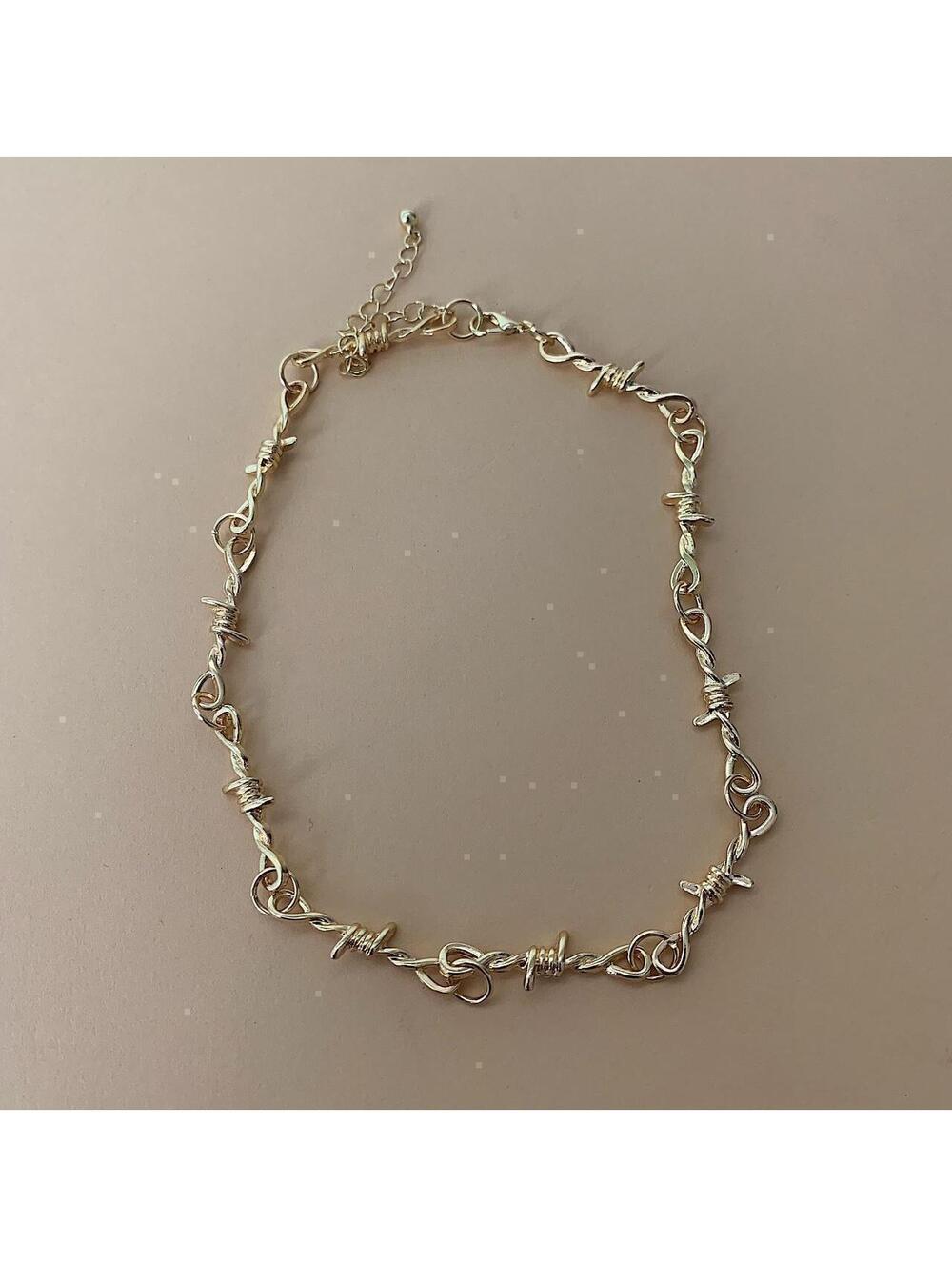 Y2k gold barbwire opium punk style chocker necklace. Cool design. Nice quality.
